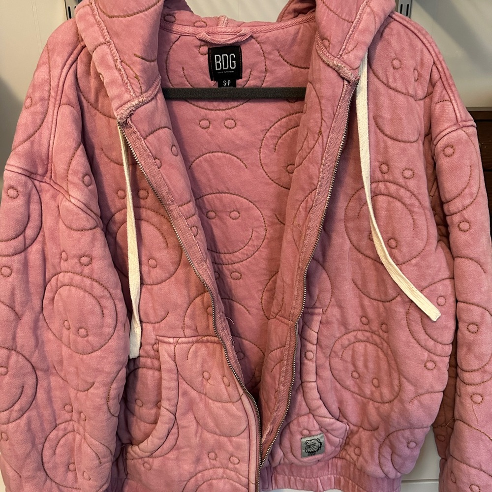 BDG pink smiley face quilted jacket.